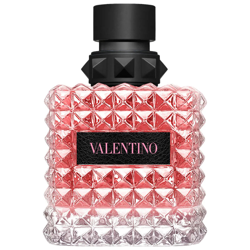 Valentino perfume bottle with pink diamond pattern and black cap on a white background