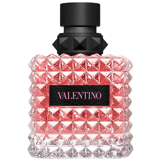 Valentino perfume bottle with pink diamond pattern and black cap on a white background