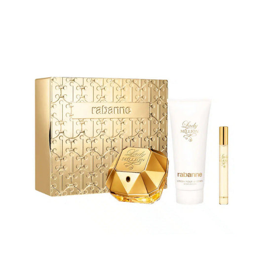 Rabanne Lady Million perfume set with gold bottle, packaging, and smaller items on a white background