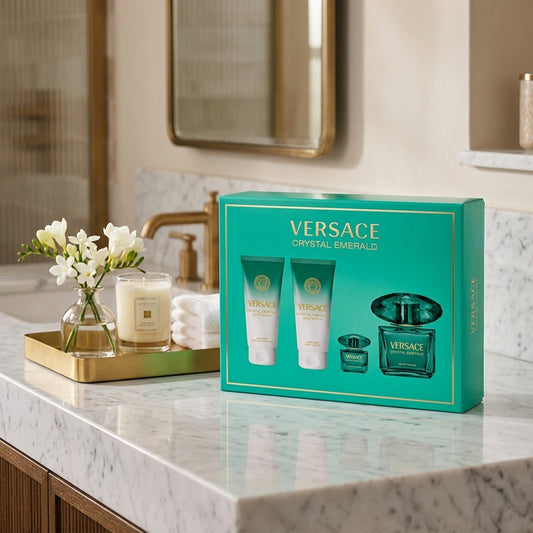 Versace Crystal Emerald fragrance set displayed on luxury marble vanity