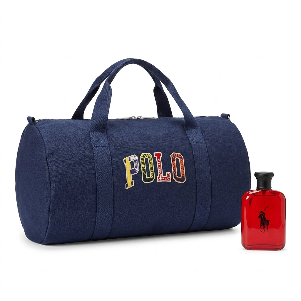 Ralph Lauren Polo Red EDT bottle standing next to navy varsity duffle bag on white studio background