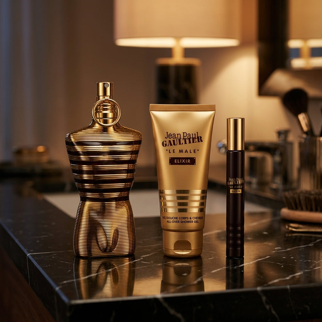 Jean Paul Gaultier Le Male Elixir set arranged on luxury dark marble vanity
